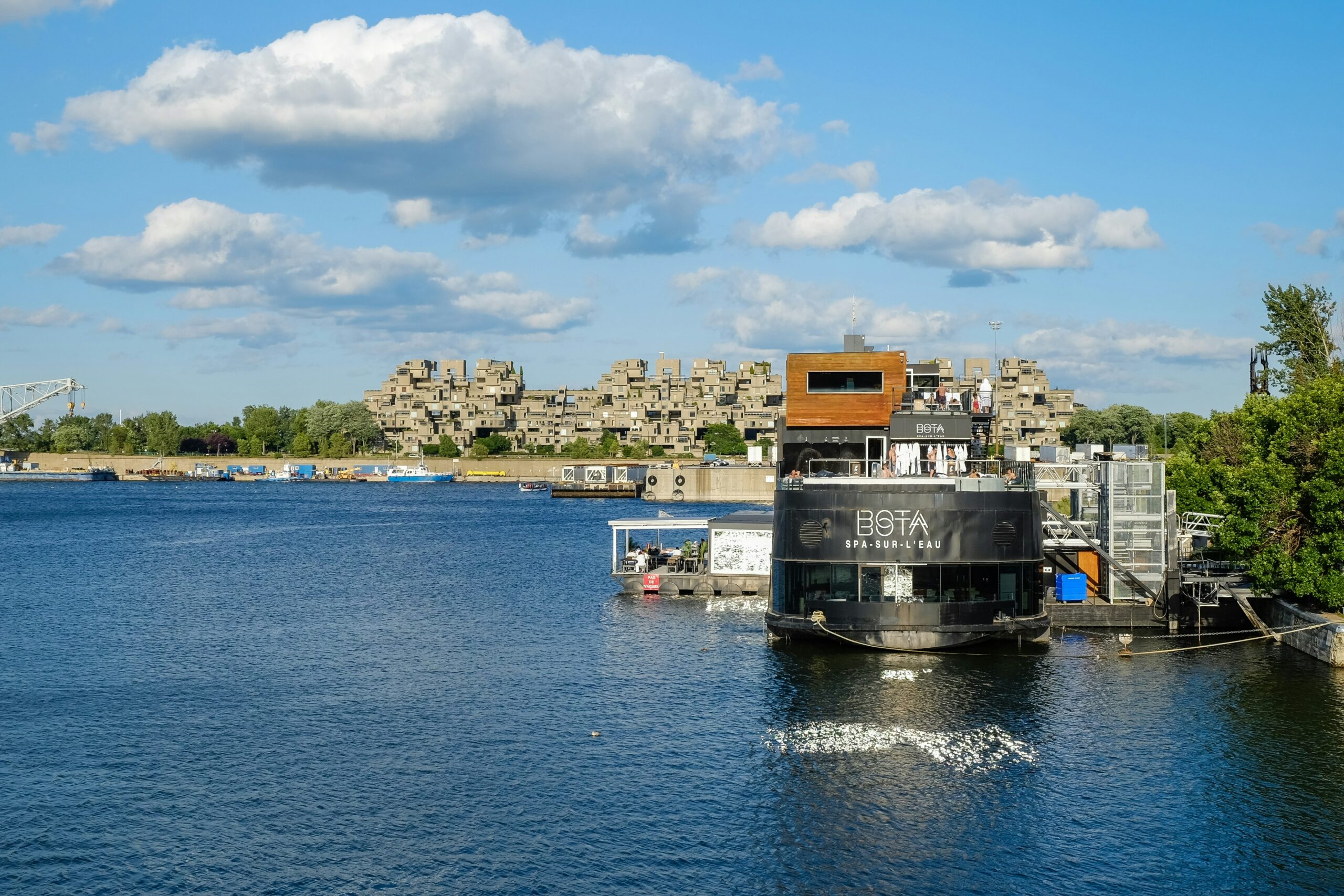 black and yellow boat on sea under blue sky during daytime